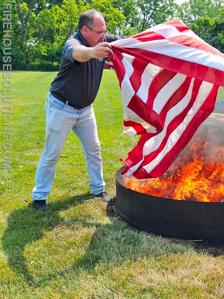 Our coordinator, former Marine, burning a large flag. 
